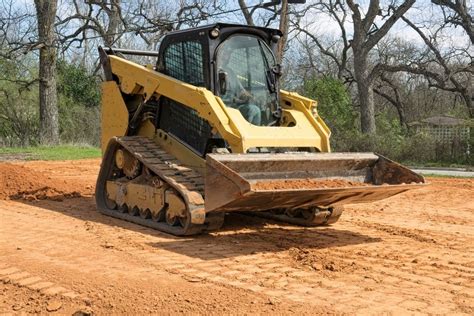 grading a sloped lot skid steer|leveling ground with skid steer.